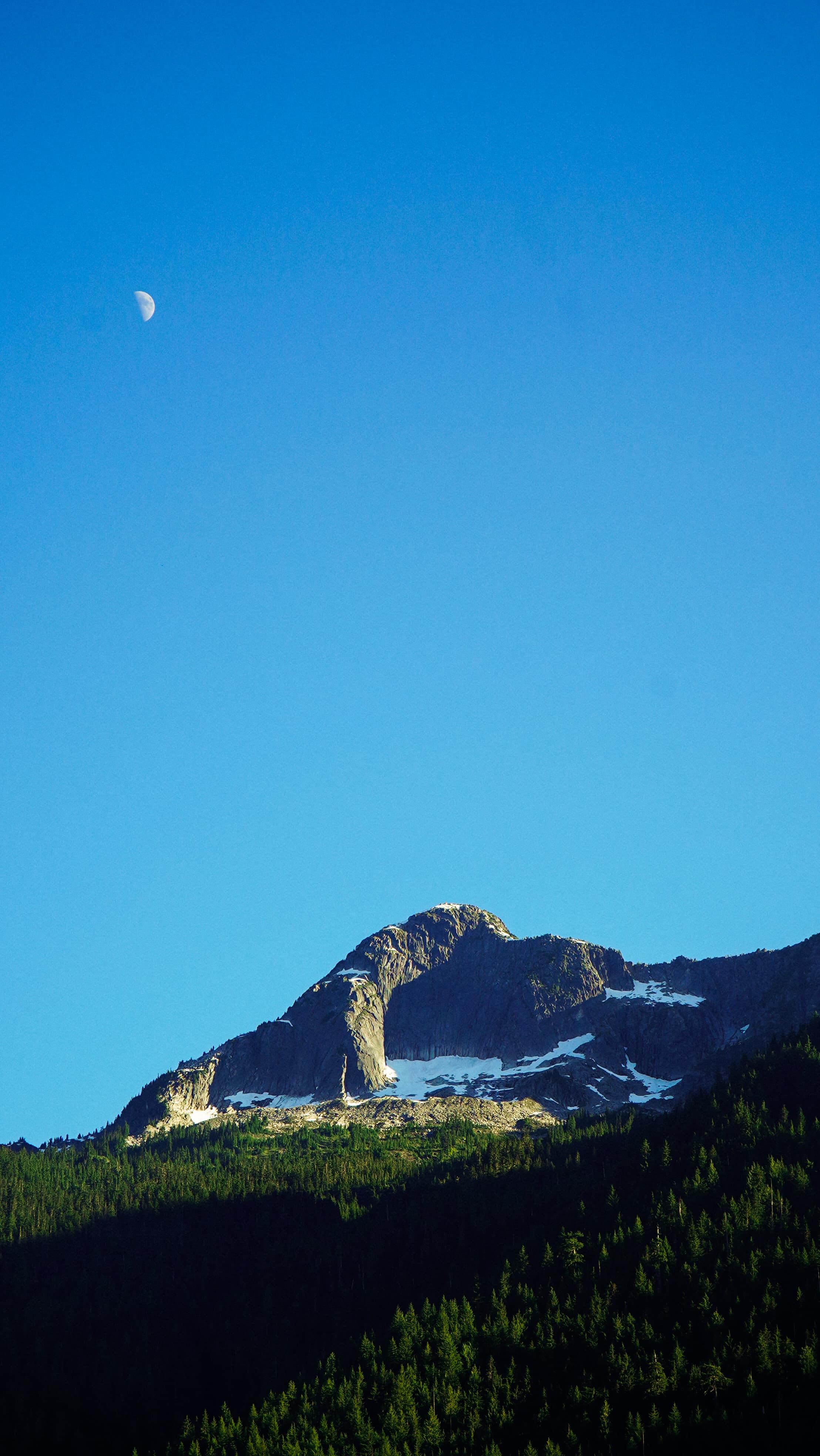 Silhouette against a mountain panorama