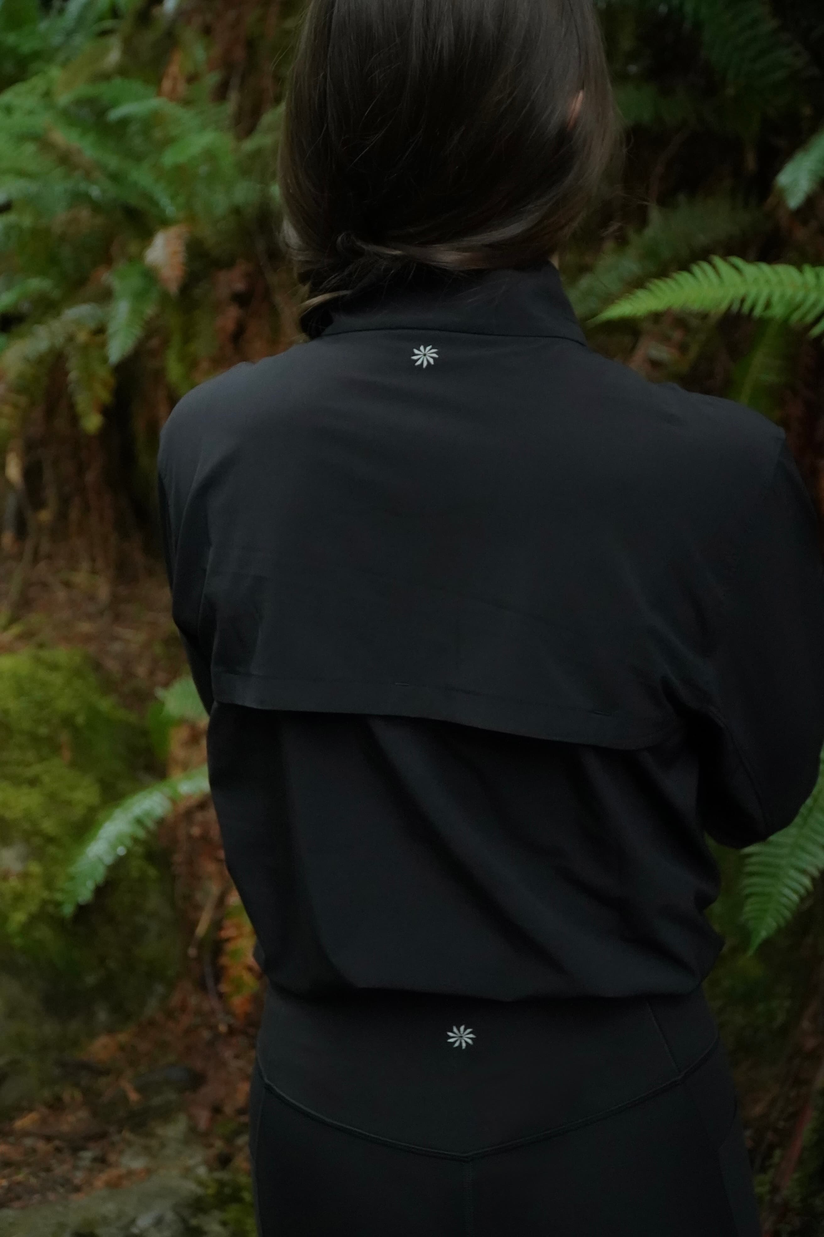 Athleta logo detail — sun jacket in the ferns