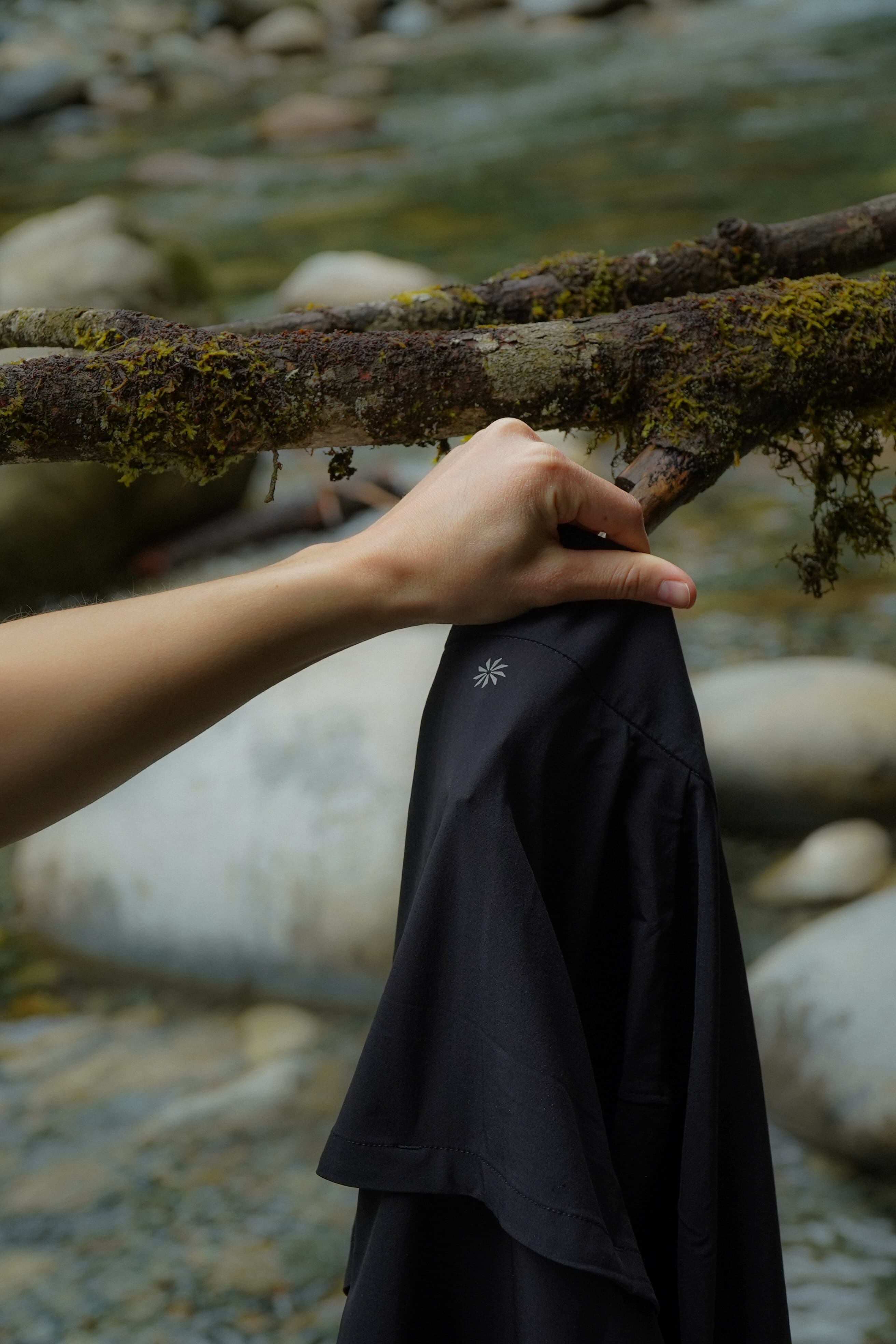 Gear detail — Athleta skirt over river rocks