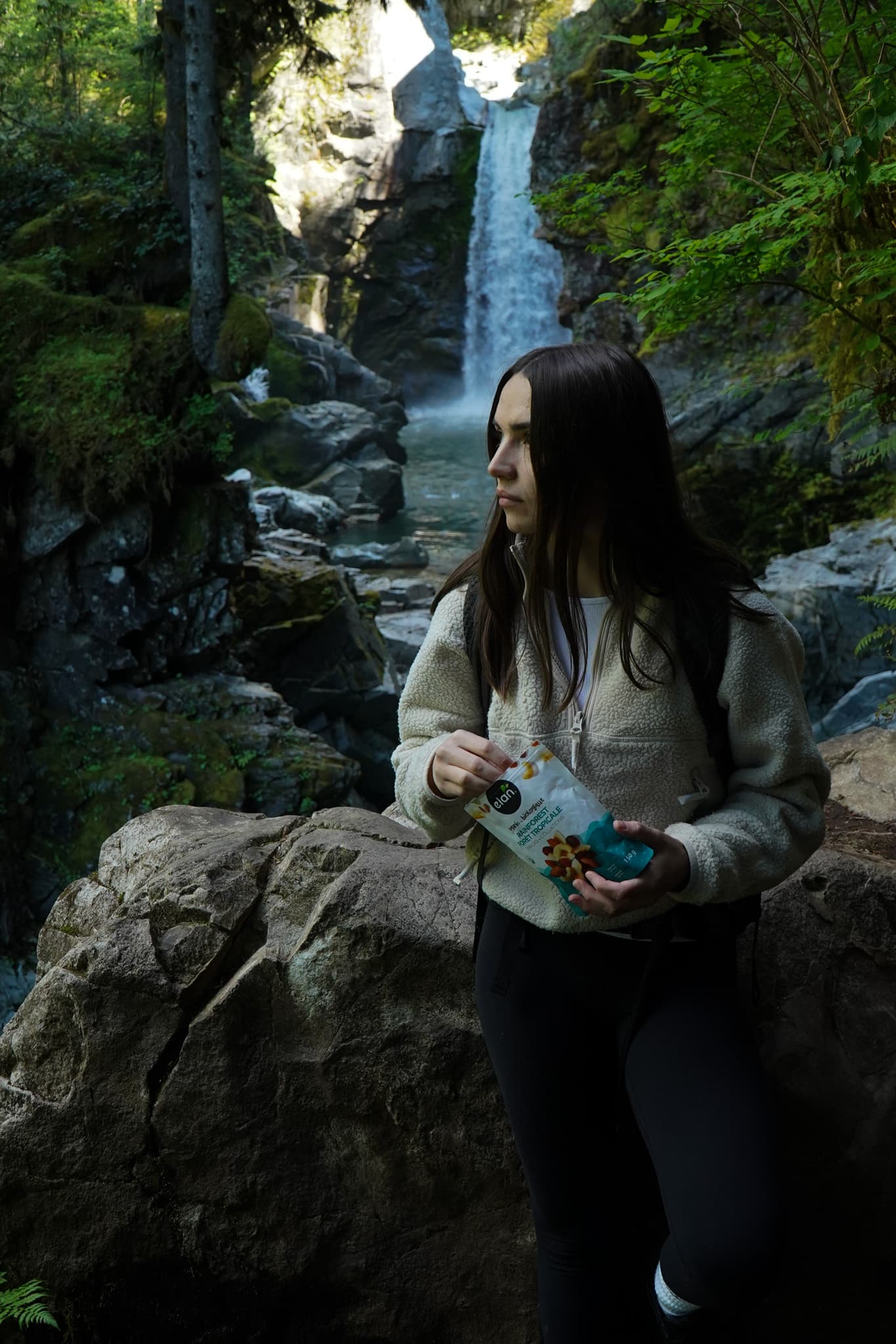 Organic snacks in nature — Elan superfood mixes by a backcountry waterfall