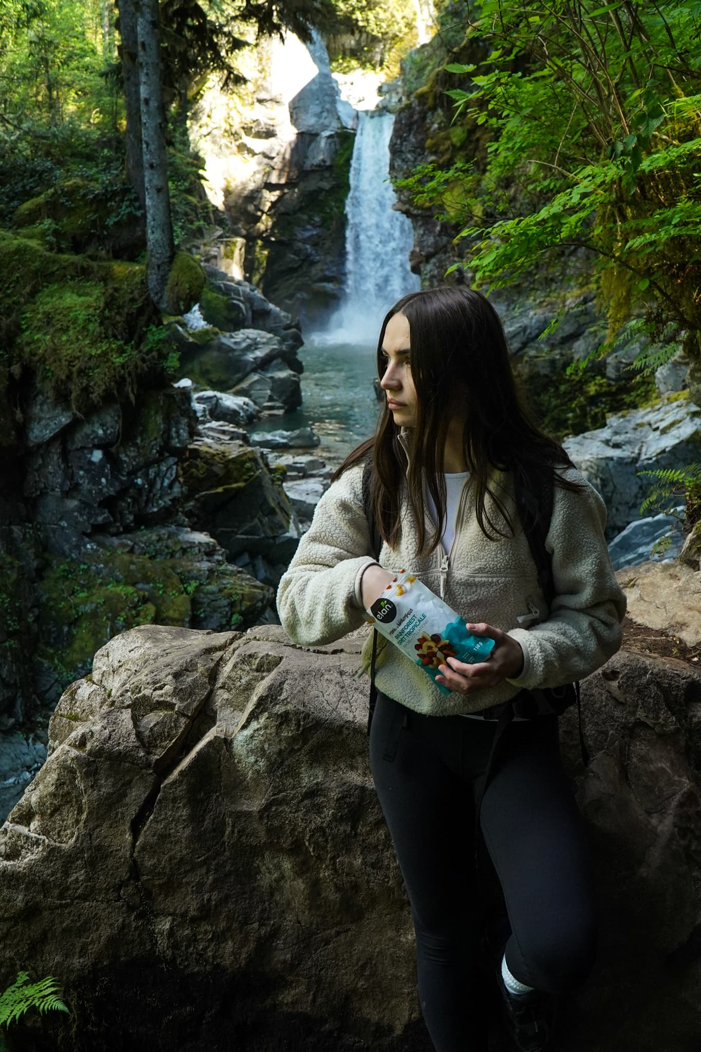 Organic snacks in nature — Elan superfood mixes by a backcountry waterfall