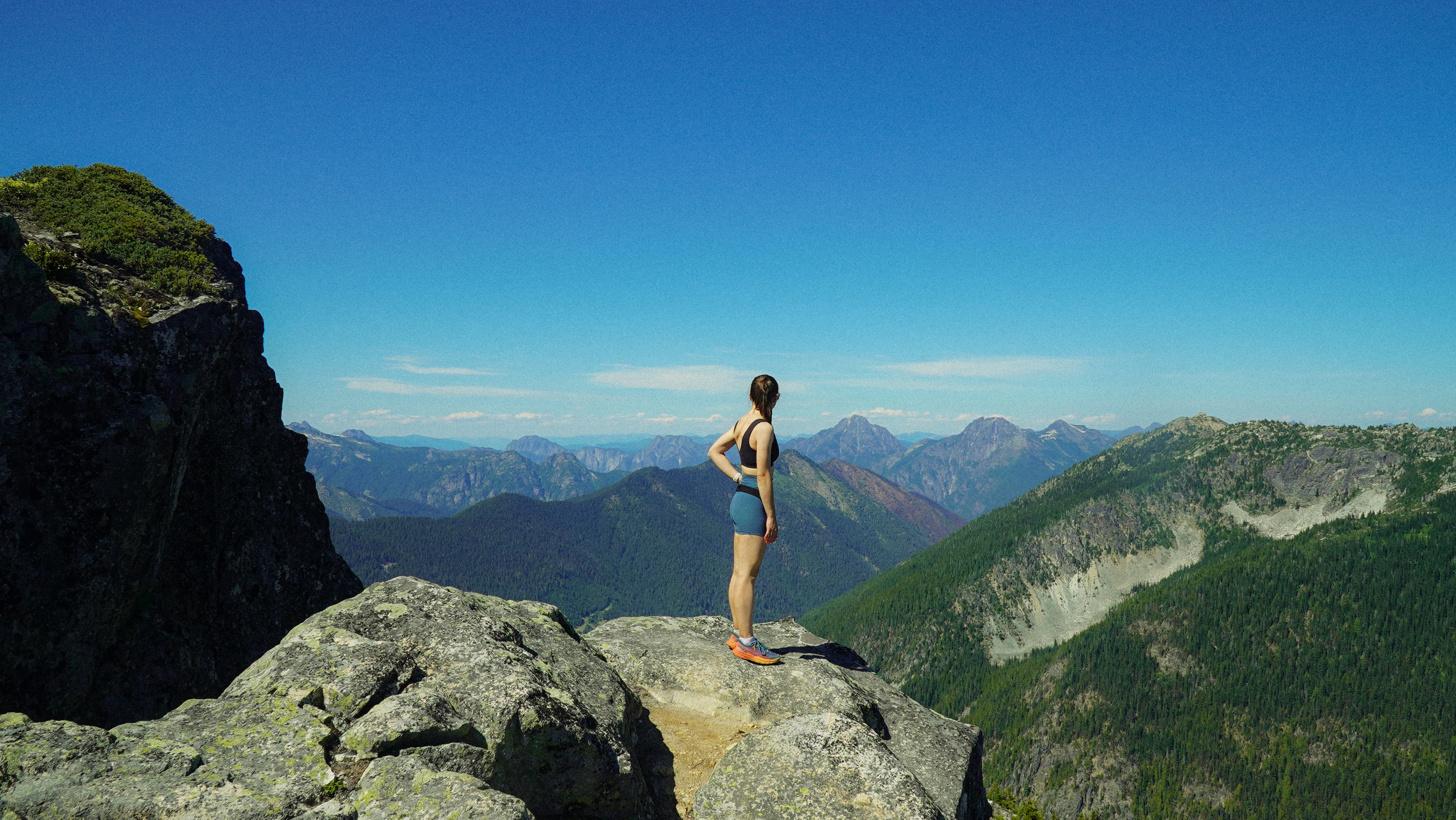 Summit panorama — Cascade Range ridgeline in Lululemon activewear
