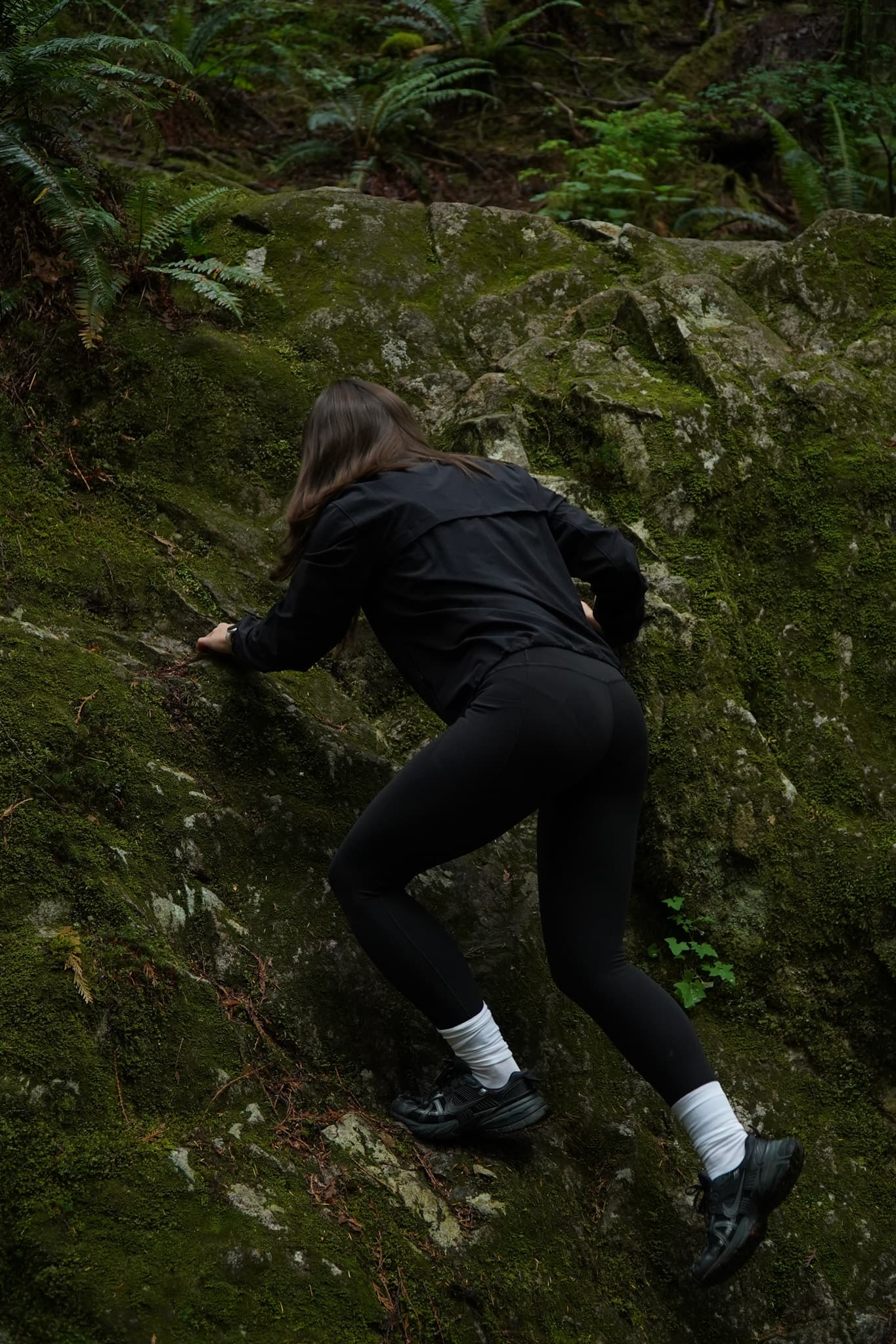Athleta Sun Sports — scrambling a moss-covered rock face